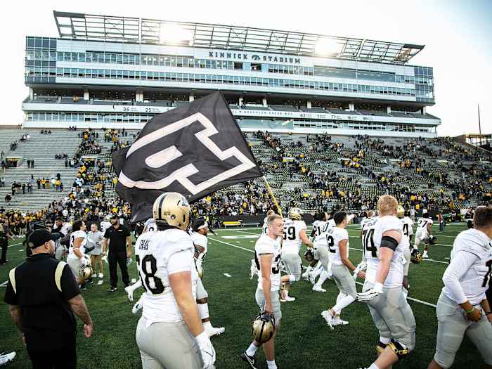 Purdue players celebrate their win at Iowa